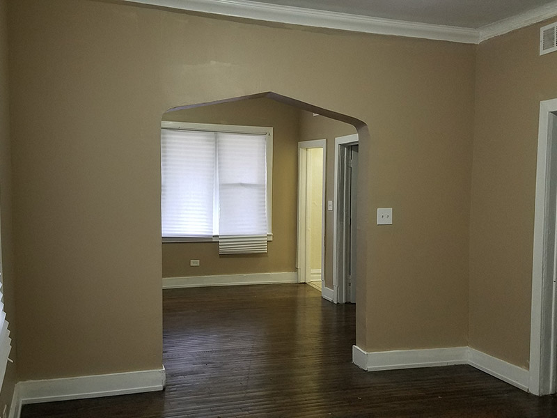 Dining room with hardwood floors in 2059 W. 68th St Section 8 Property