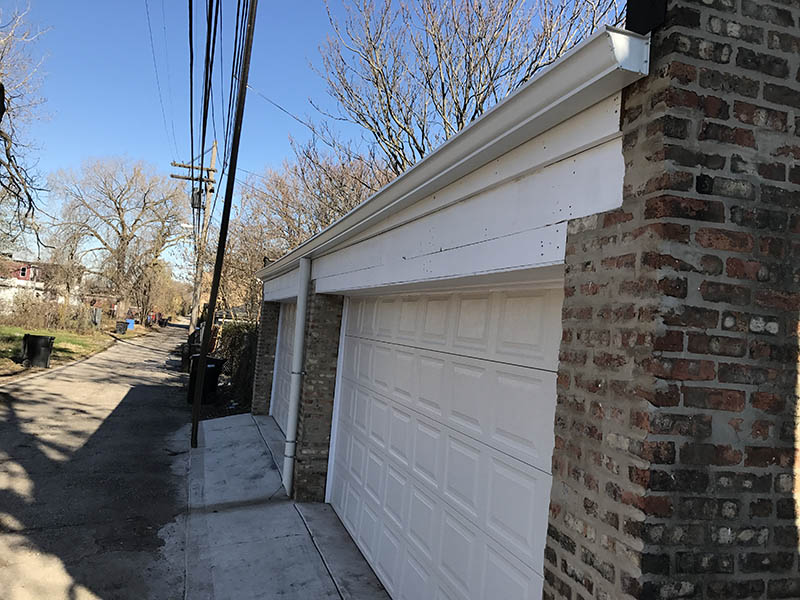 Rear exterior garage view of 7332-34 S. May section 8 investment Property