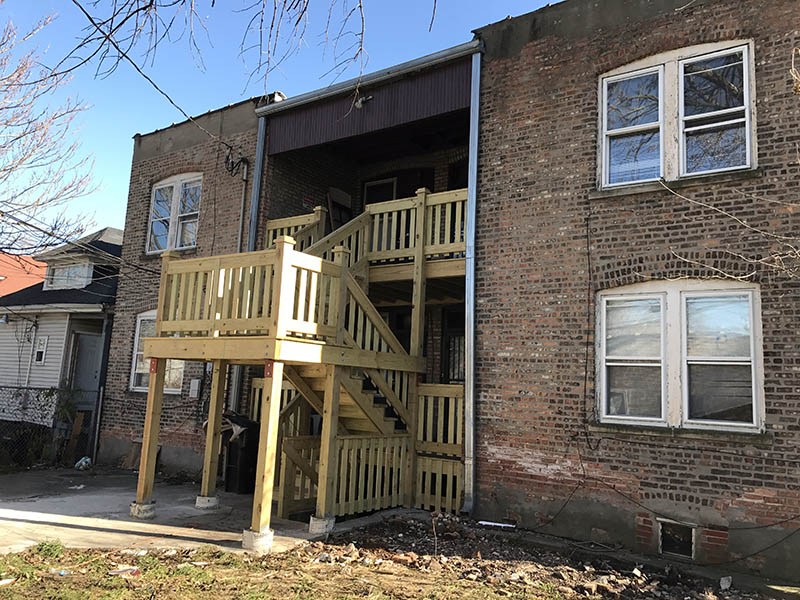 Rear exterior view of 7332-34 S. May section 8 investment Property