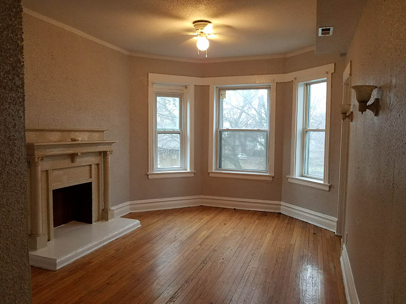 Interior view showing windows and hardwood floors in 7827 S. Marquette Section 8 Property