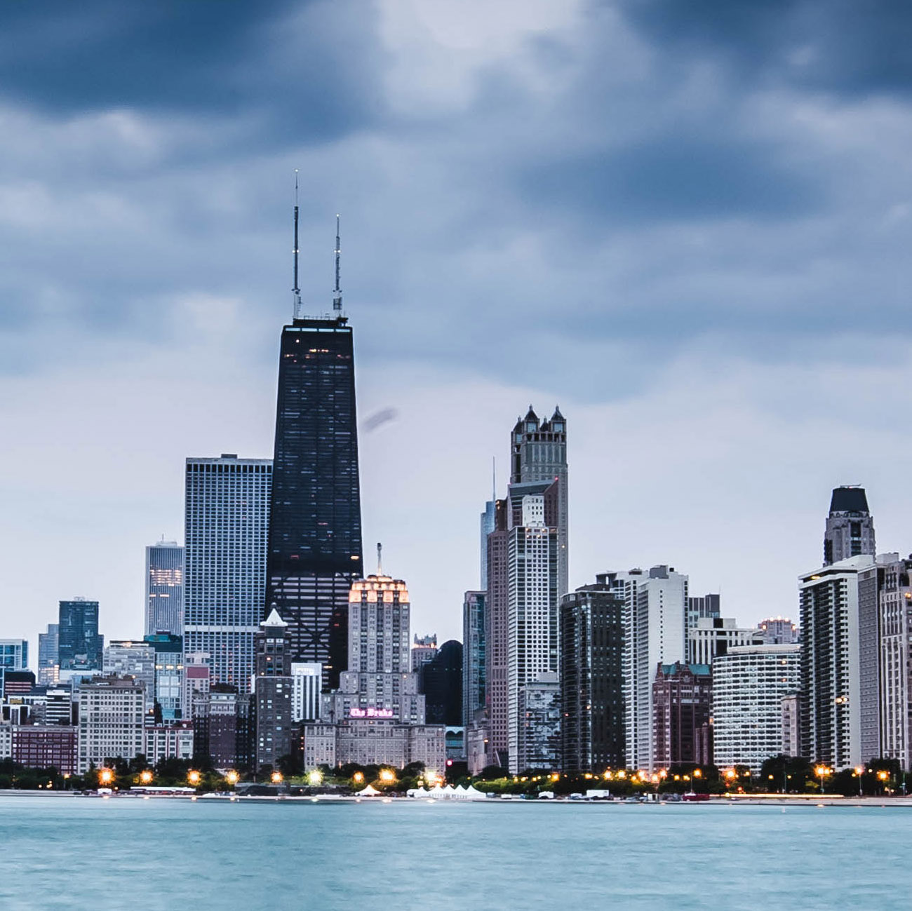 Chicago skyline above Lake Michigan on a cloudy day square