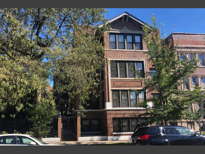 Front exterior view of 4553 S. Michigan section 8 condo building